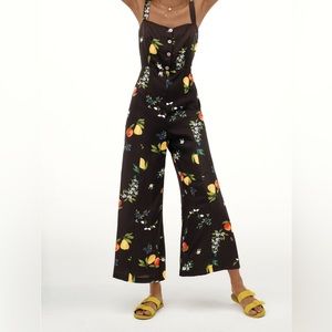 Citrus Grove jumpsuit in black with a fun fruit motif. Total Miami vibe.